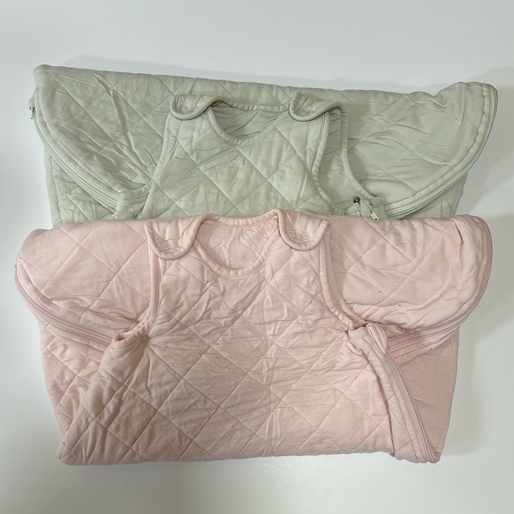 A bundle of two  pottery barn baby sleeveless sleep sacks